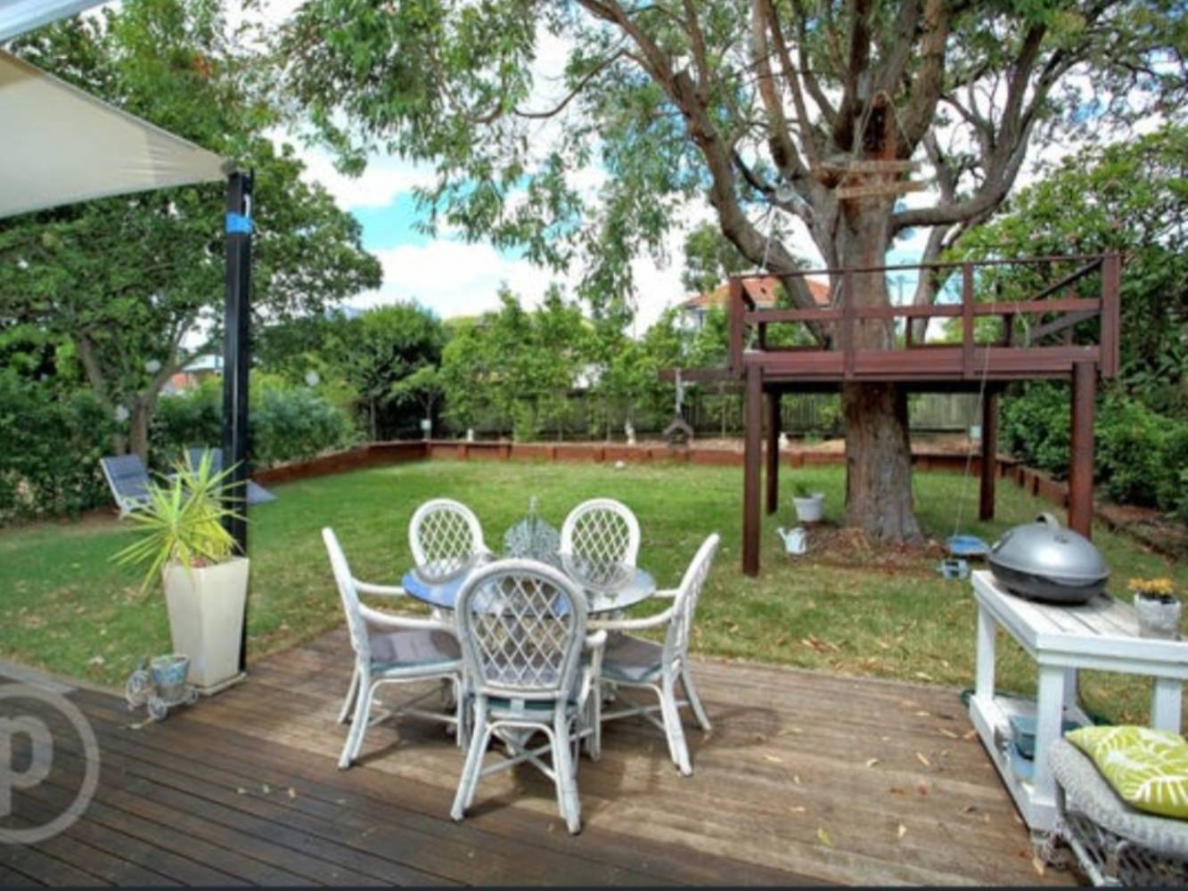 Backyard with treehouse
