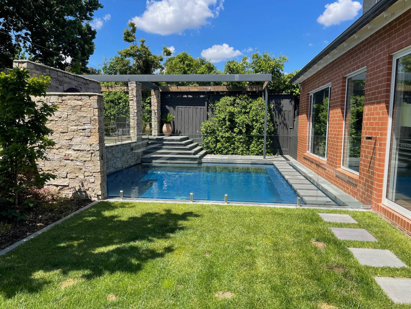 Back lawn and heated pool
