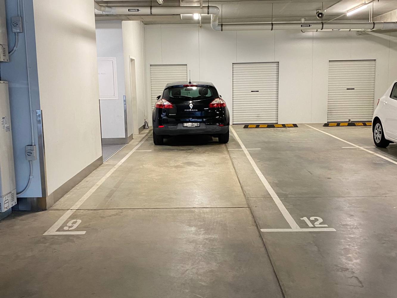 Tandem car spaces right beside elevator