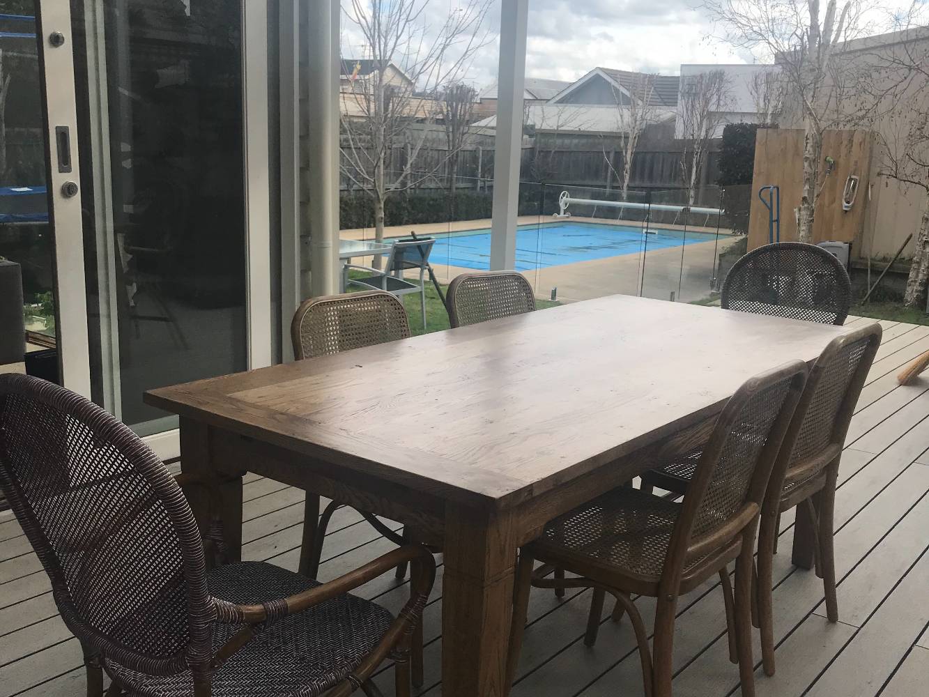 New out door deck. Table can be extended to seat 12 ppl.photo taken in winter. Trees block view of neighbouring houses during Spring/Summer. See earlier pool photo.