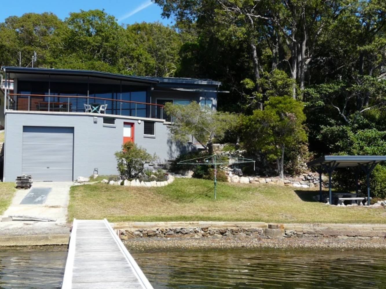 Our waterfront home from our jetty, pergola on right