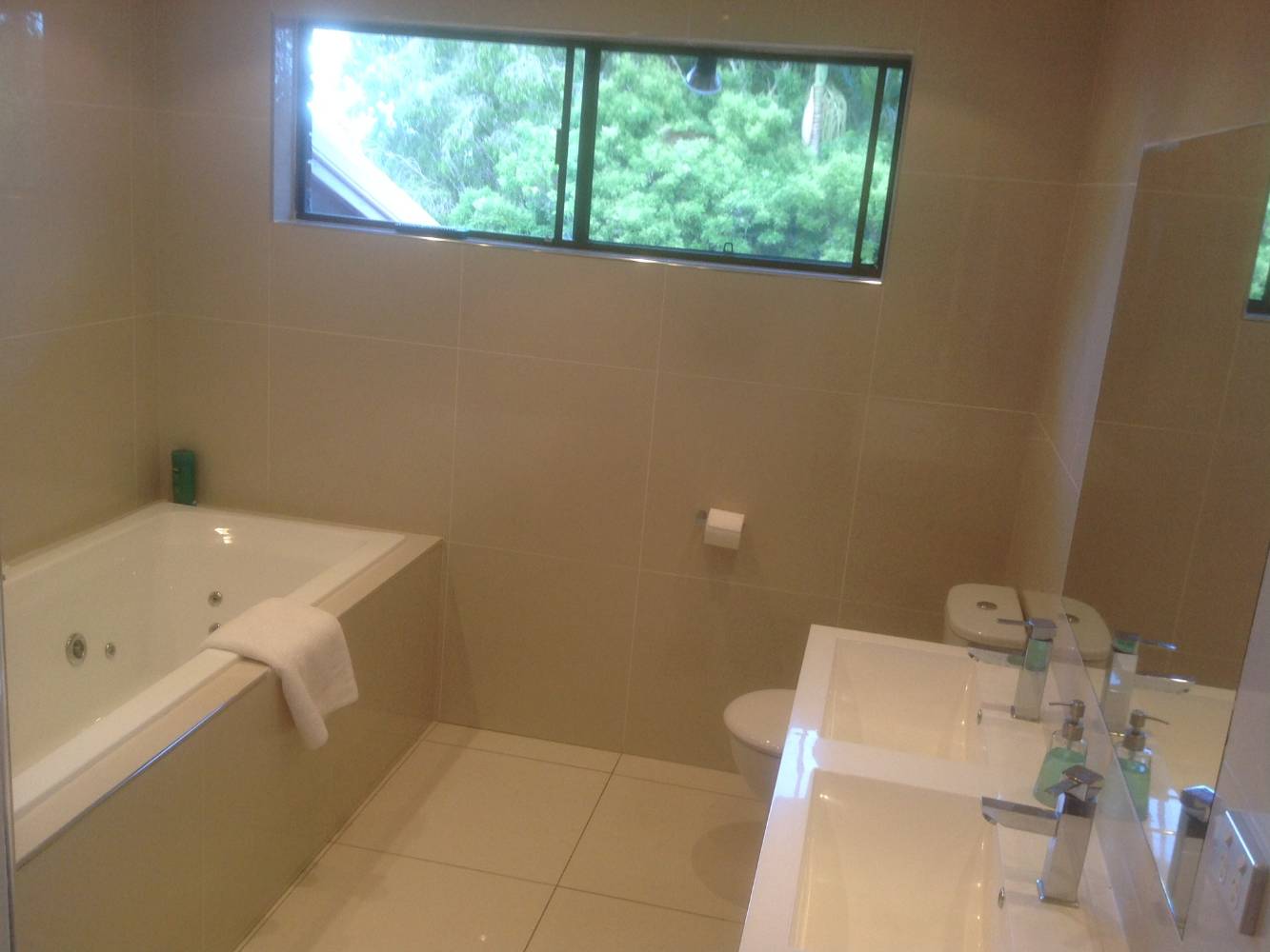 Main bathroom with spa bath and separate shower