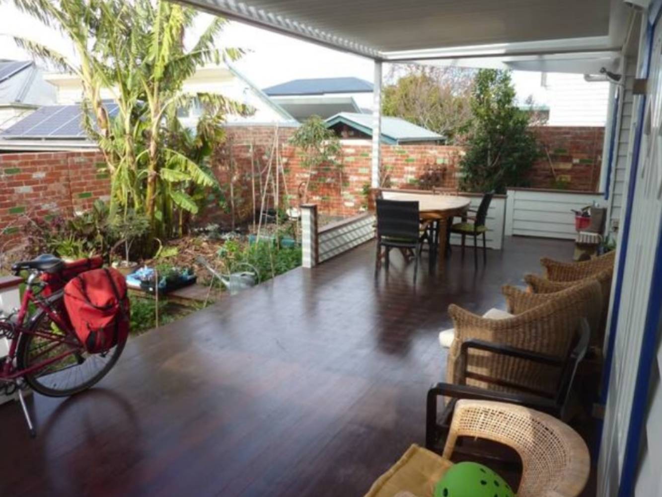 Private rear garden with timber deck & electric opening louvre roof