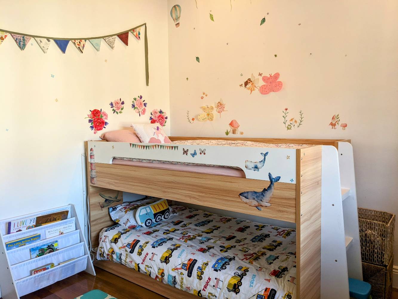 Low lying bunk beds in kids room (top bunk is chest height for an adult), ceiling fan, large window facing street, soft play mat, toys