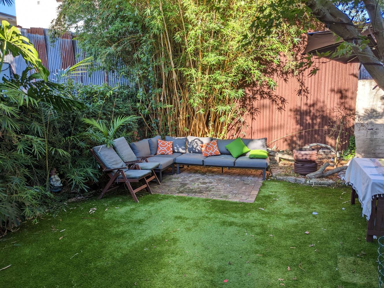 Cosy backyard with moveable fire pit (in this shot it's to the right, we'll move it onto the bricks so you can chill