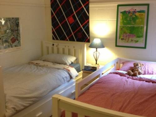 Childrens' bedroom downstairs (now erected as double bunks). Adjacent to 2nd bathroom and childrens play/rumpus room.