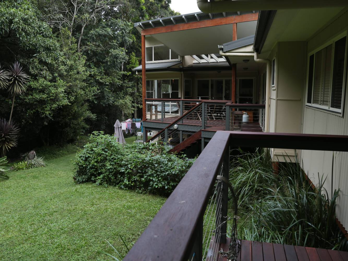 Spacious yard with herb garden, lawn and a subtropical rainforest to explore.