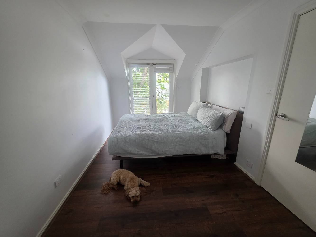 Master bedroom with queen bed + balcony
