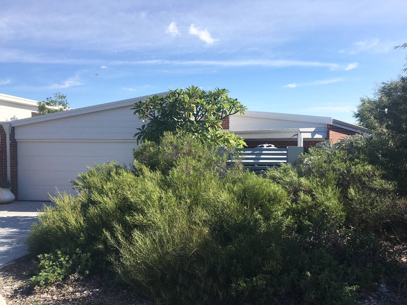 Front of home - private and secure with locked gate and double auto garage