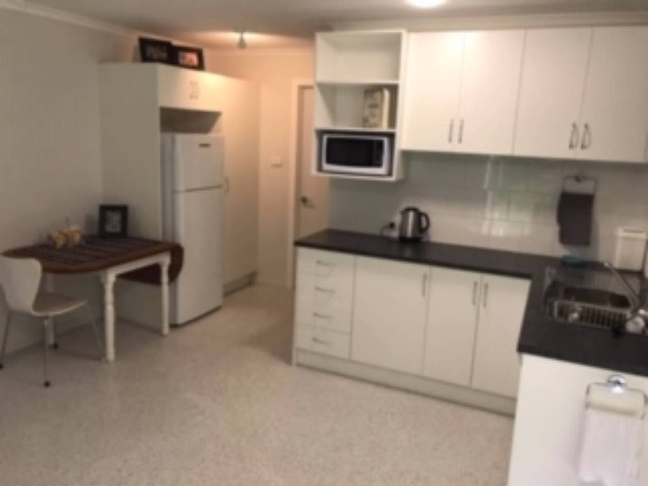 Studio apartment with access to own bathroom and laundry.