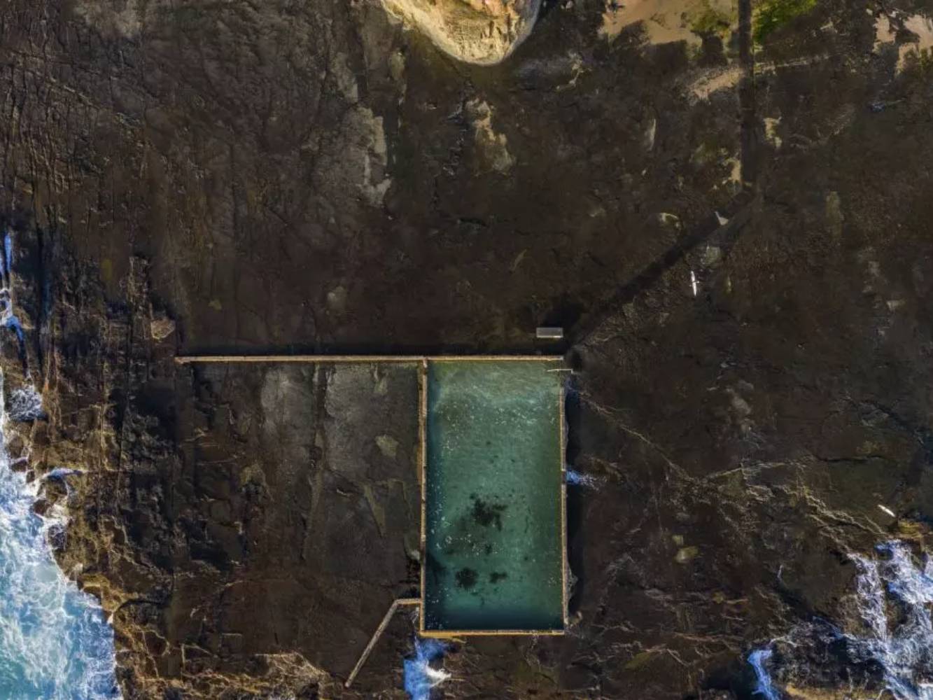 Aerial view of werri beach ocean pool (5 min drive)