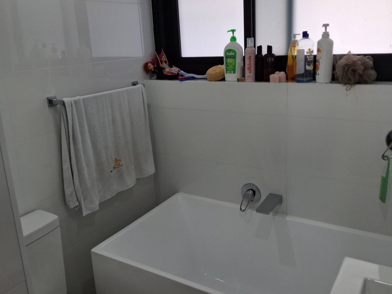 newly renovated bathroom with bath